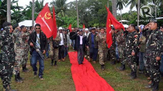 REBELLION. In this file photo, MNLF leader Nur Misuari inspects his armed followers in one of the group's camps in Indanan, Sulu. AFP file photo