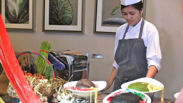 A CHEF DEMONSTRATES HOW to make pasta. Yup, those blobs on the plates are pasta!