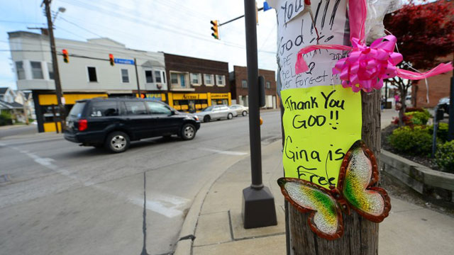 CLEVELAND, United States - Signs and balloons hang on a street pole near where Gina De Jesus was last seen a decade ago, after three women were held captive for a decade in a house, May 8, 2013 in Cleveland, Ohio. Three brothers have been arrested in connection with the kidnapping of three women found safe in a home after being missing for a decade, authorities said. Ariel Castro and his brothers - Pedro, 54, and Onil, 50 have been detained, authorities said. AFP PHOTO/Emmanuel Dunand