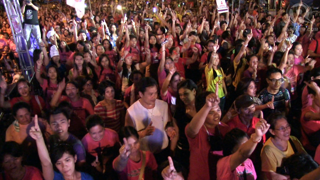 EVERYONE IS RISING. A single finger is raised to stand for 1 billion and the act of raising one's self up