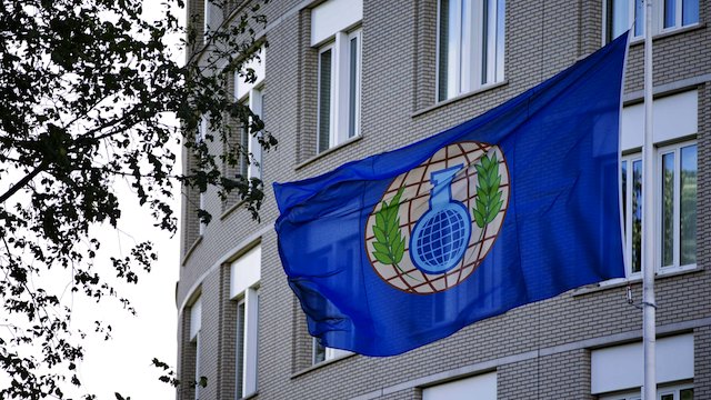 A file picture dated 31 August 2013 shows the flag of the Organization for the Prohibition of Chemical Weapons (OPCW) in front of their building in The Hague, The Netherlands. File photo by Guus Schonewille/EPA