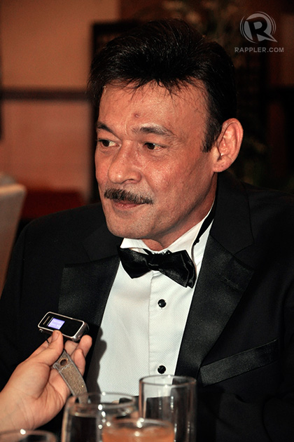 Mark Gil plays Larry Gomez