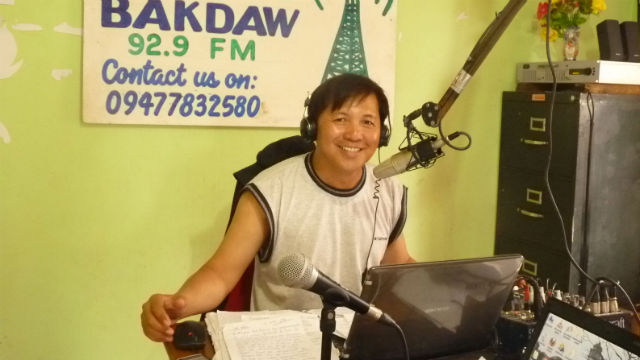 HUMANITARIAN RADIO. A radio announcer at this booth in Radyo Bakdaw in Guiuan, Eastern Samar