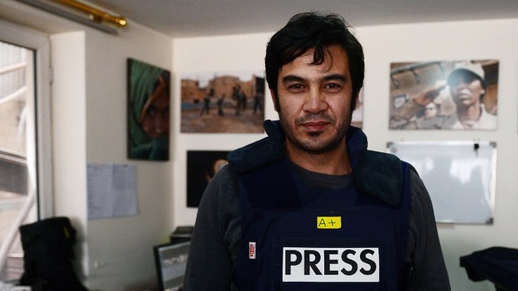 SLAIN JOURNALIST. Sardar Ahmad, 40, a Kabul based staff reporter at the Agence France-Presse (AFP) news agency poses for a photo at the AFP office in Kabul hours before he, his wife and two of his three children were gunned down in Kabul's Serena hotel. Photo by Wakil Kohsar/AFP