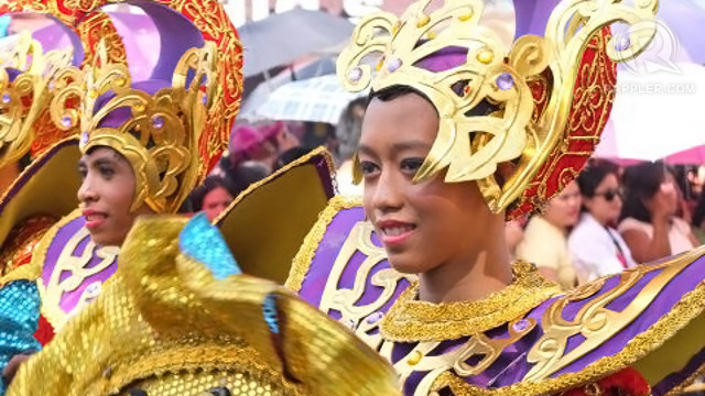 A STREET DANCER uses a pause in choreography to enjoy the spectacle