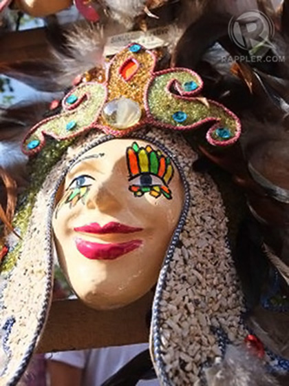 PUT ON A SMILE. One of the many masks sold in stalls along the streets