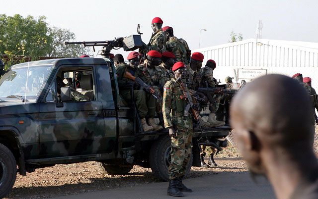 CLASHES. South Sudanese soldiers on their vehicle patrol a street in Juba, South Sudan, December 20, 2013. File photo by Phillip Dhil/EPA