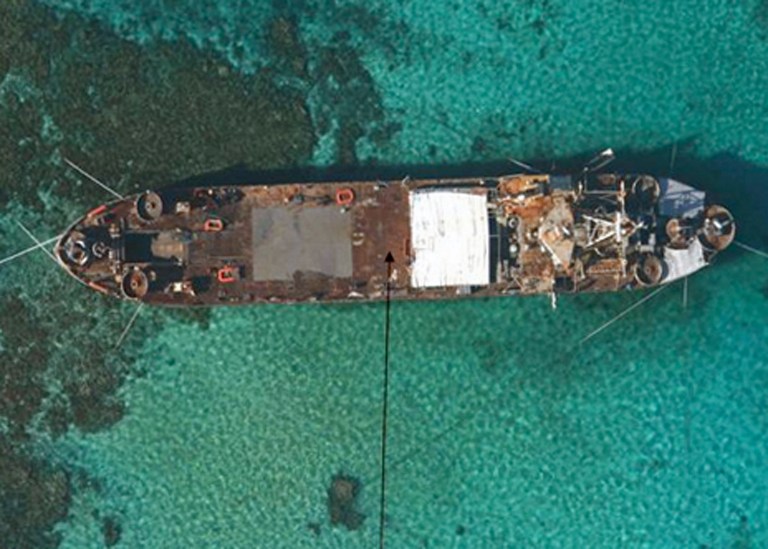 SEA BASTION. This undated handout photo released by the Philippine Government on May 23, 2013 shows an aerial view of BRP Sierra Madre, a 100-meter (328 foot) amphibious vessel built for the US in 1944 and acquired by the Filipino navy in 1976, grounded at Second Thomas Shoal in the Spratly Islands. AFP PHOTO / Philippine Government