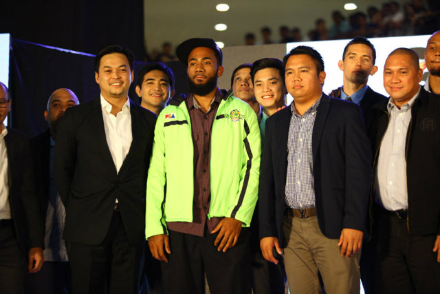 GLOBAL DOMINATION. Stanley Pringle stands on the stage after being selected first overall by the Globalport Batang Pier. File photo by Josh Albelda
