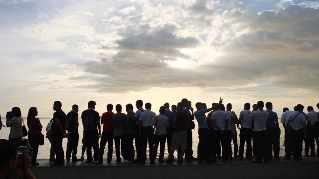 GATHERED FOR SUNDOWN. Watchers wait for the sunset