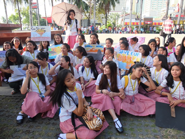 THE STUDENTS' CRY. Students of nearby schools carry art project placards declaring their opposition to the Gold Coast reclamation project