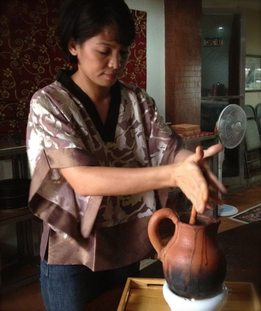 JUST LIKE LOLA TAUGHT her. Raquel mixes her spiced chocolate concoction with a traditional batirol. File photo taken in Cebu by  Andrea Lugue.