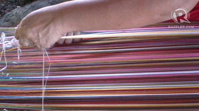 LOCAL CRAFTS. A Yakan local’s hands weaving colorful threads at Yakan Village, Zamboanga City