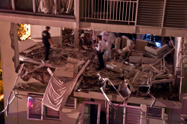 QUESTIONS PERSIST. A unit at Two Serendra is damaged by a May 31 blast. 