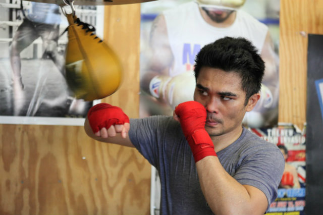 BRIAN KNOWS. Former two-division champion Brian Viloria hits the speed bag at the Wild Card Gym. Viloria likes his compatriot's chances in the Bradley rematch. Photo by Jhay Otamias/Rappler