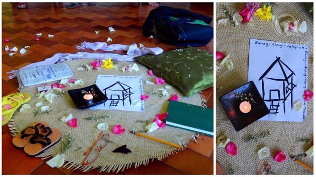(Left) Objects laid out by workshop participants to represent the journey of 'coming home to one’s true self.' The drawing of the house in the middle is surrounded by the word 'home' in different Filipino languages. (Right) Close-up of the house drawing.