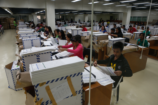 TESTING BALLOTS. In NPO, casual employees test 52.3-M ballots using up to 150 PCOS machines. Photo by Rappler/John Javellana