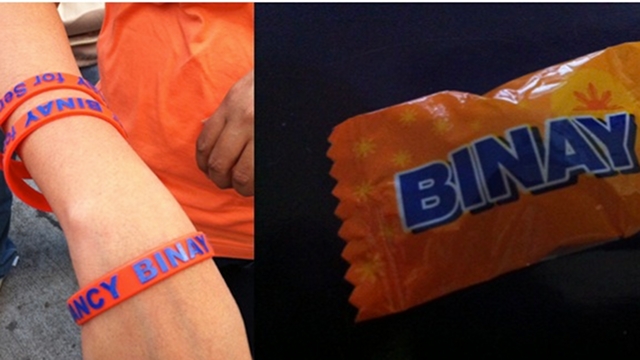 CAMPAIGN FREEBIES. Nancy Binay gives out ballers and candies during sorties. Her father says though that critics made an issue out of her candies even if she is not endorsing any product. Photos by Ayee Macaraig