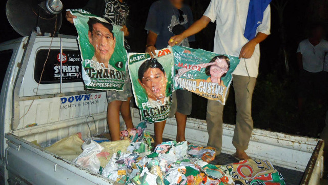 TORN UP. 54 sacks of posters of candidates from the Achievement with Integrity Movement bets was found on the evening of May 7. Photo by Aquiles Zonio